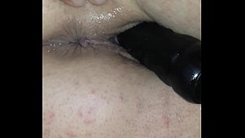 Dildo in pussy, finger in ass, she doesn't wake